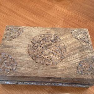 Indian hand carved wooden box.  Blue felt lining.